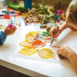 Children doing autumn handcrafts